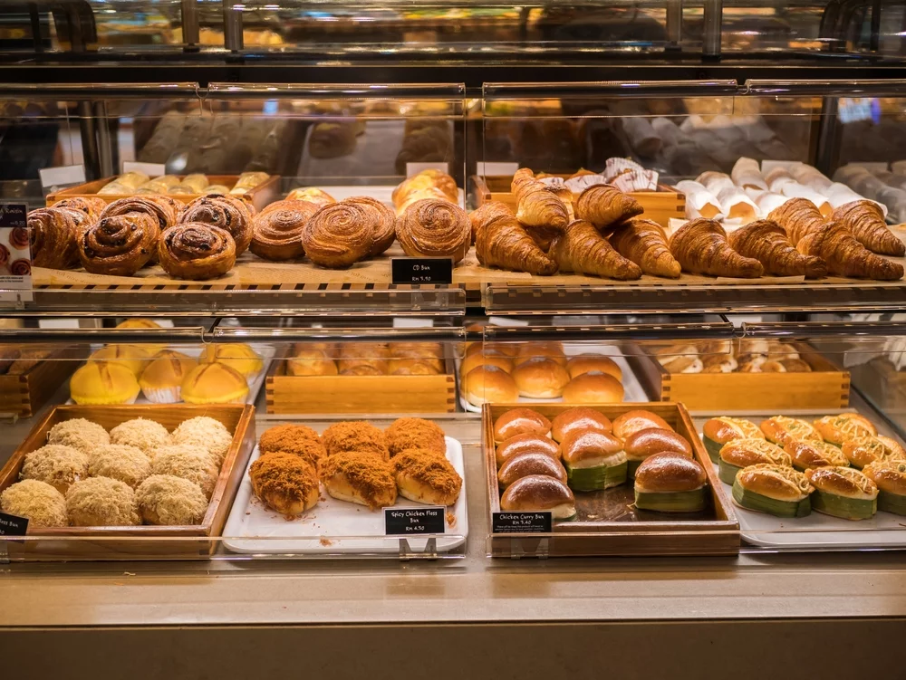 Freshly baked assorted pastries and buns on display at one of the best bakers in dehradun